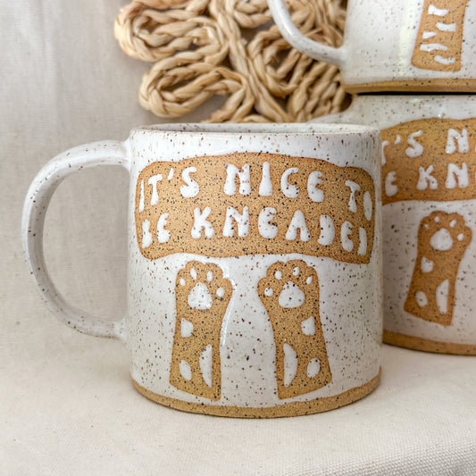 “It’s nice to be kneaded” mug
